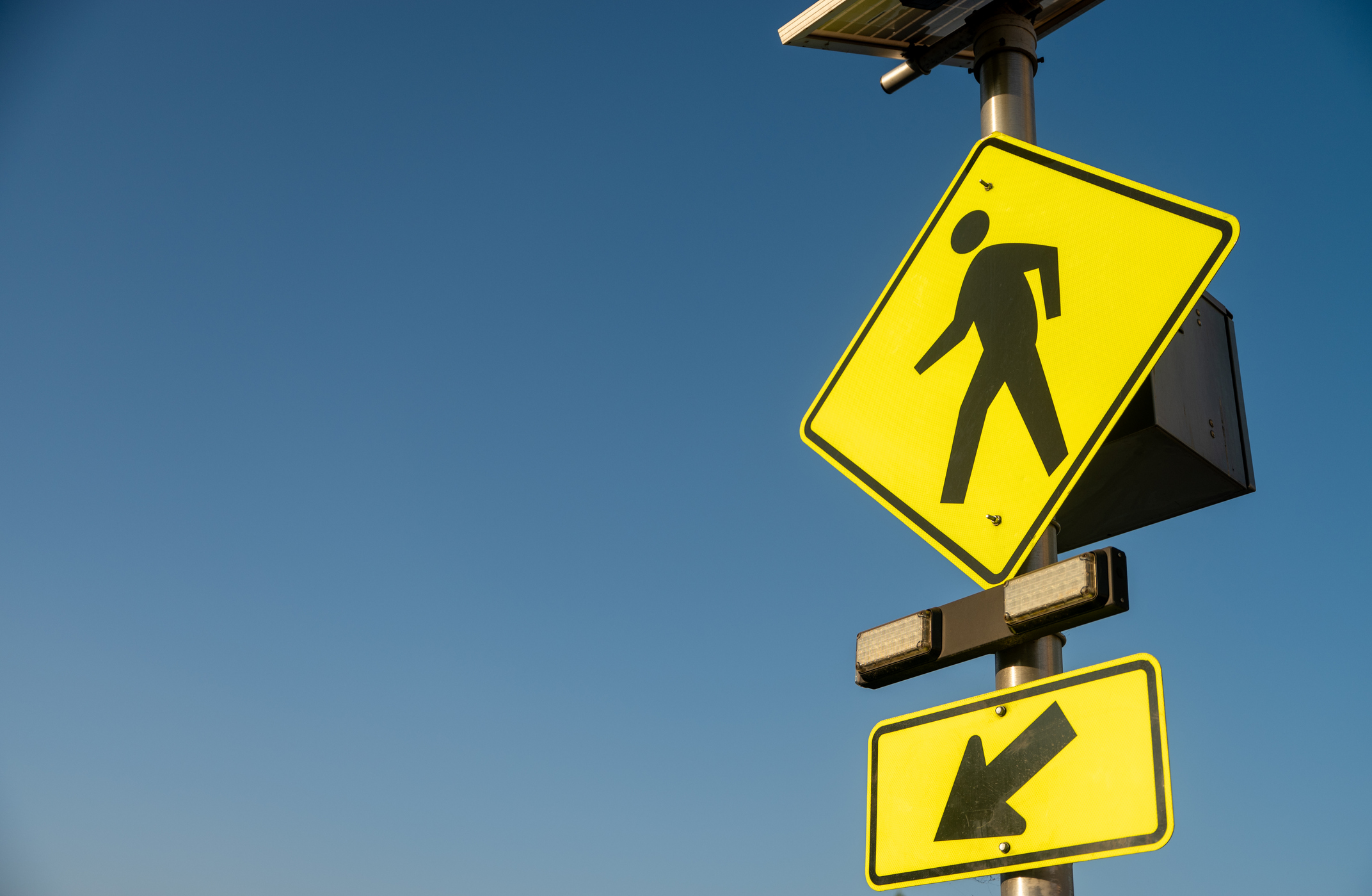 Close up of walking sign
